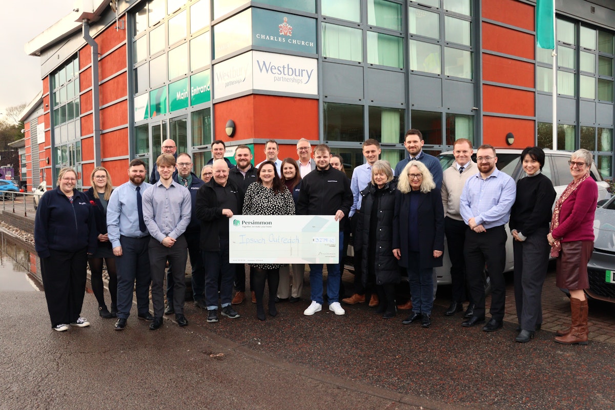 Persimmon Homes team presenting the Ipswich Outreach team with a giant cheque